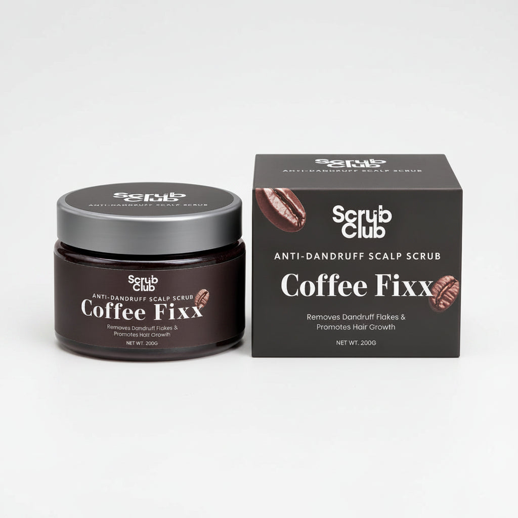 A dark brown jar of Scrub Club Coffee Fixx Scalp Scrub next to its dark gray packaging box, both featuring coffee bean graphics and white text on a clean white background.