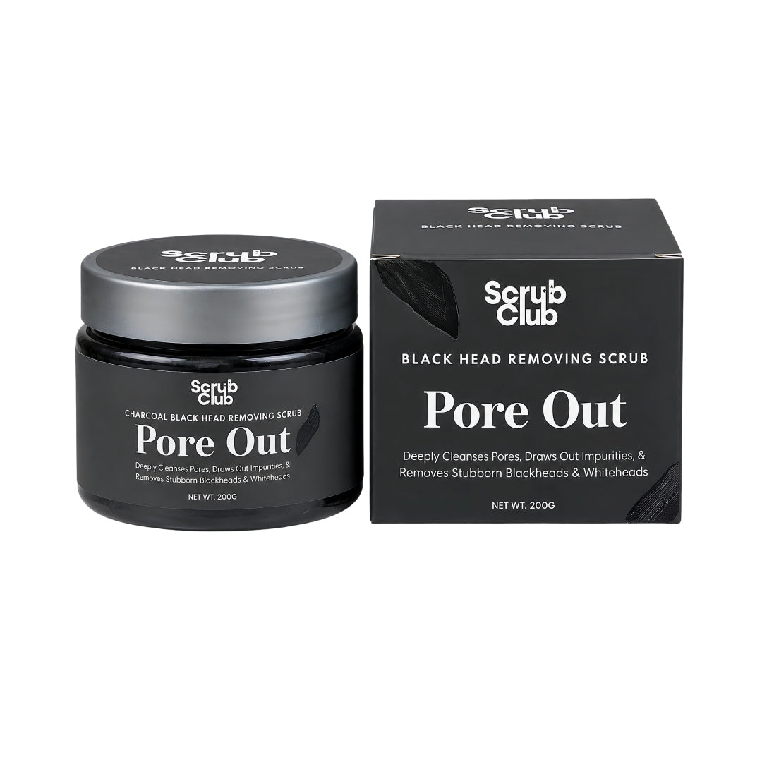 A black jar of Scrub Club Pore Out Black Head Removing Scrub next to its black retail box on a plain white background.